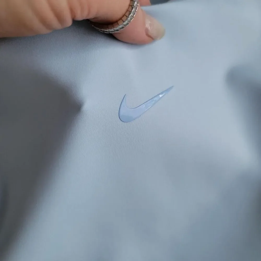 NWT NIKE FORM women's training top in baby blue, size xxs.